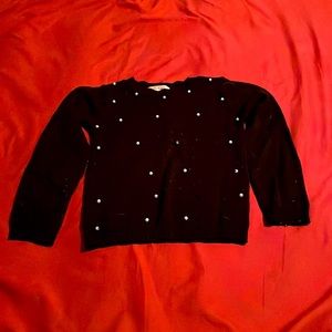 Black sweater with whit beads one the front